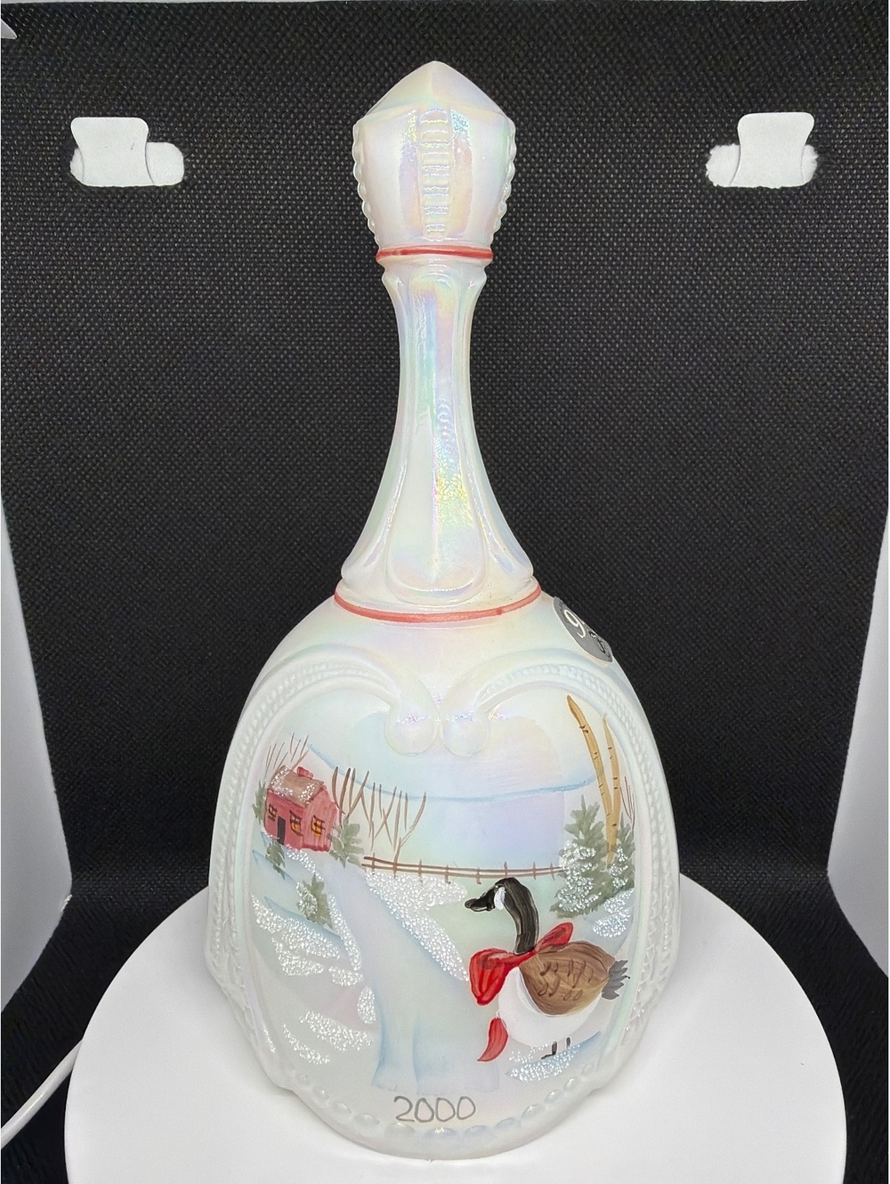 Iridescent porcelain bell with winter bird scene